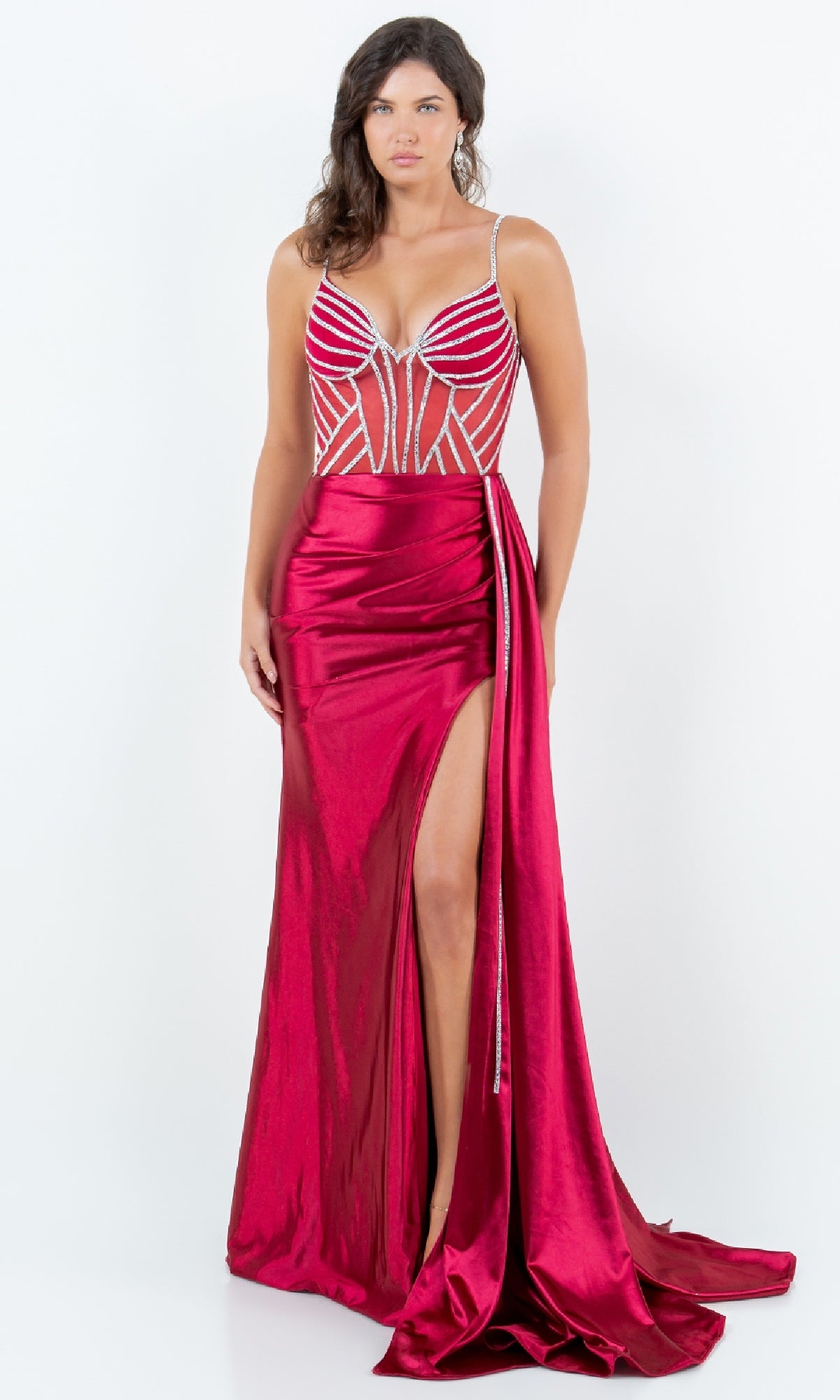 A woman poses against a plain white background in the Side-Sash Long Prom Gown (Cinderella Couture 8219J), a sleeveless, floor-length evening gown featuring a sheer bodice, beaded accents, and a high side slit.